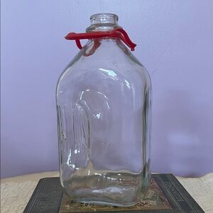 Clear Glass 1/2 gallon milk Jug with Red Carry strap